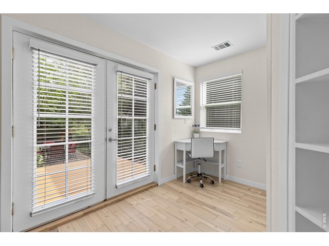 Property Photo 22 Custom french doors lead to deck and verdant garden beyond