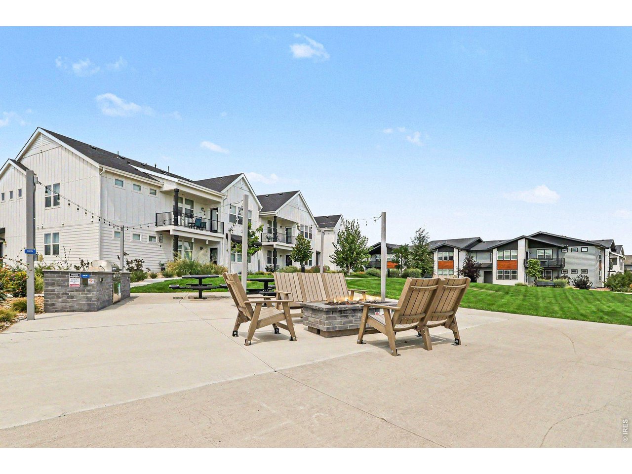 Property Photo 18 Raindance Flats outdoor kitchen, fire pit, and open space