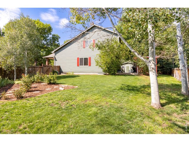 Property Photo 39 Rose garden, green grass and aspen trees.