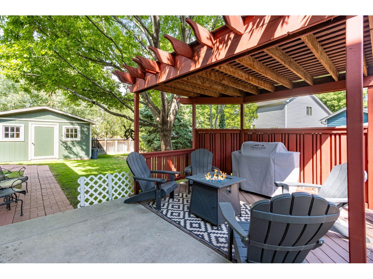 Property Photo 40 Backyard pergola and oversized shed.