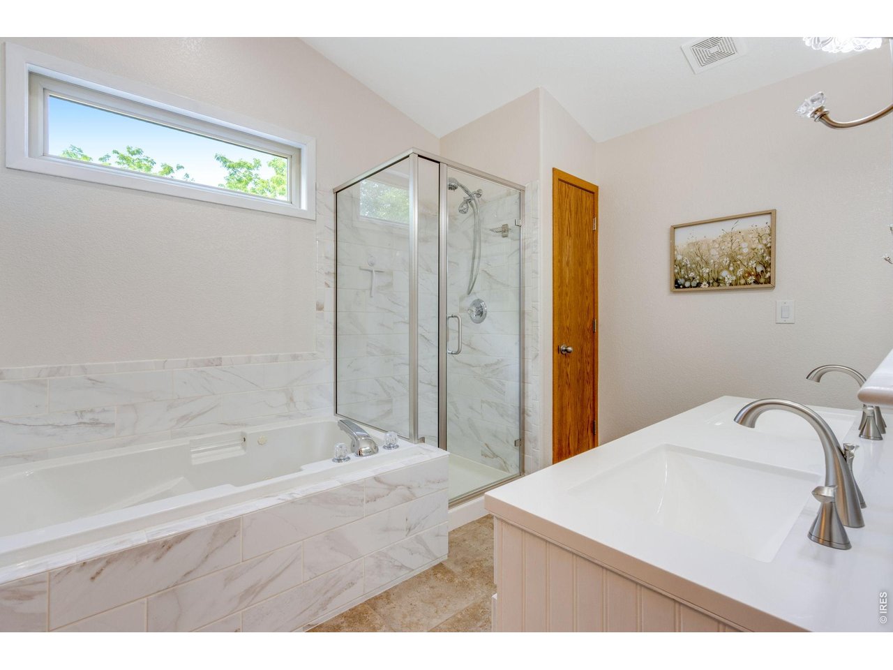 Property Photo 23 Light and bright 5 piece primary bathroom.