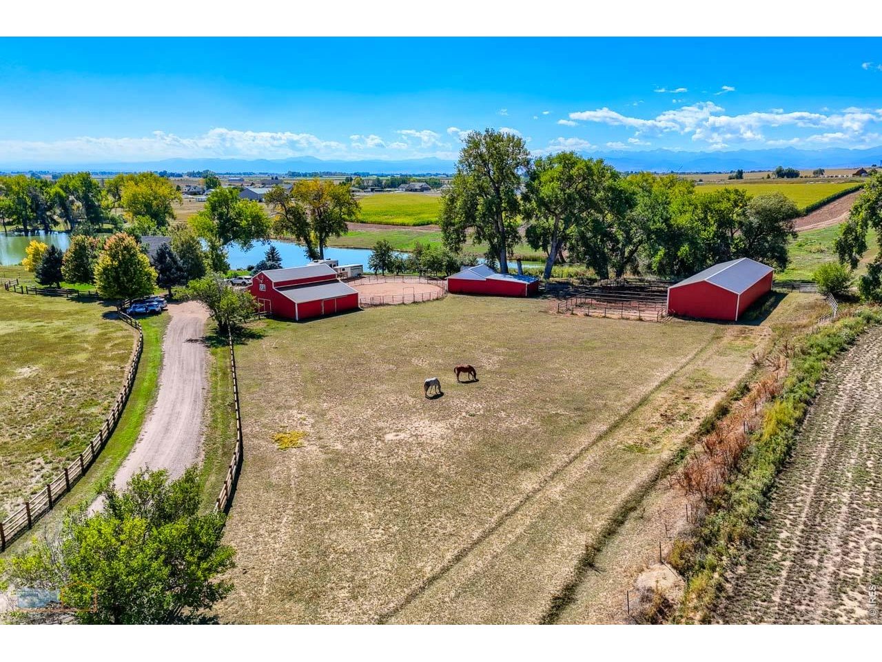 Property Photo 4 Fenced pastures and thoughtfully arranged equestrian improvements complement the ranch setting.