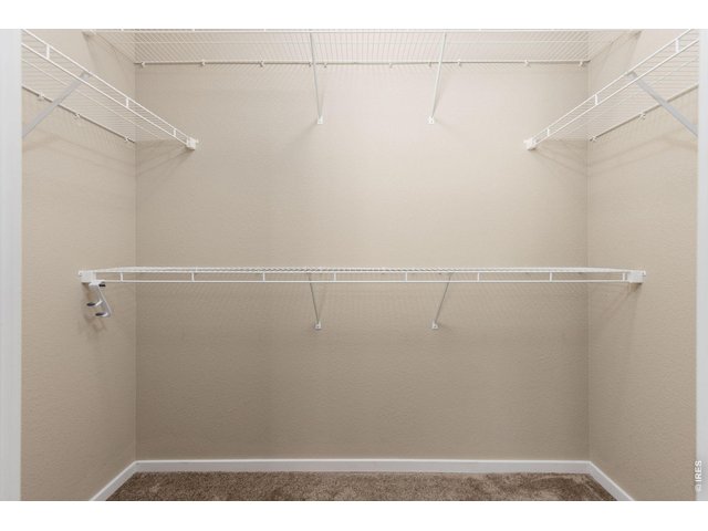 Property Photo 10 Large Walk-In Closet with Crawl Space Access