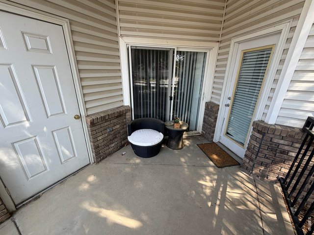 Property Photo 10 Fenced patio with access to Living Rm and Primary Bedroom
