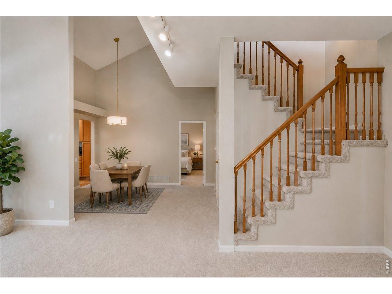 Property Photo 14 virtual staging - dining and stairs to loft