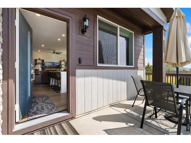 Property Photo 24 Outdoor patio space with convenient access to the kitchen and main living area.