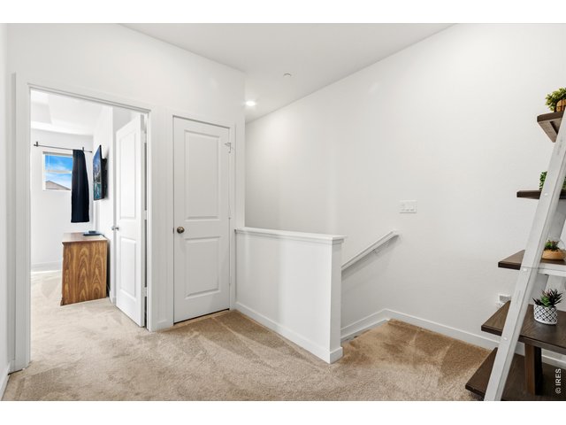 Property Photo 12 Upstairs layout provides convenient access to all three bedrooms and laundry.