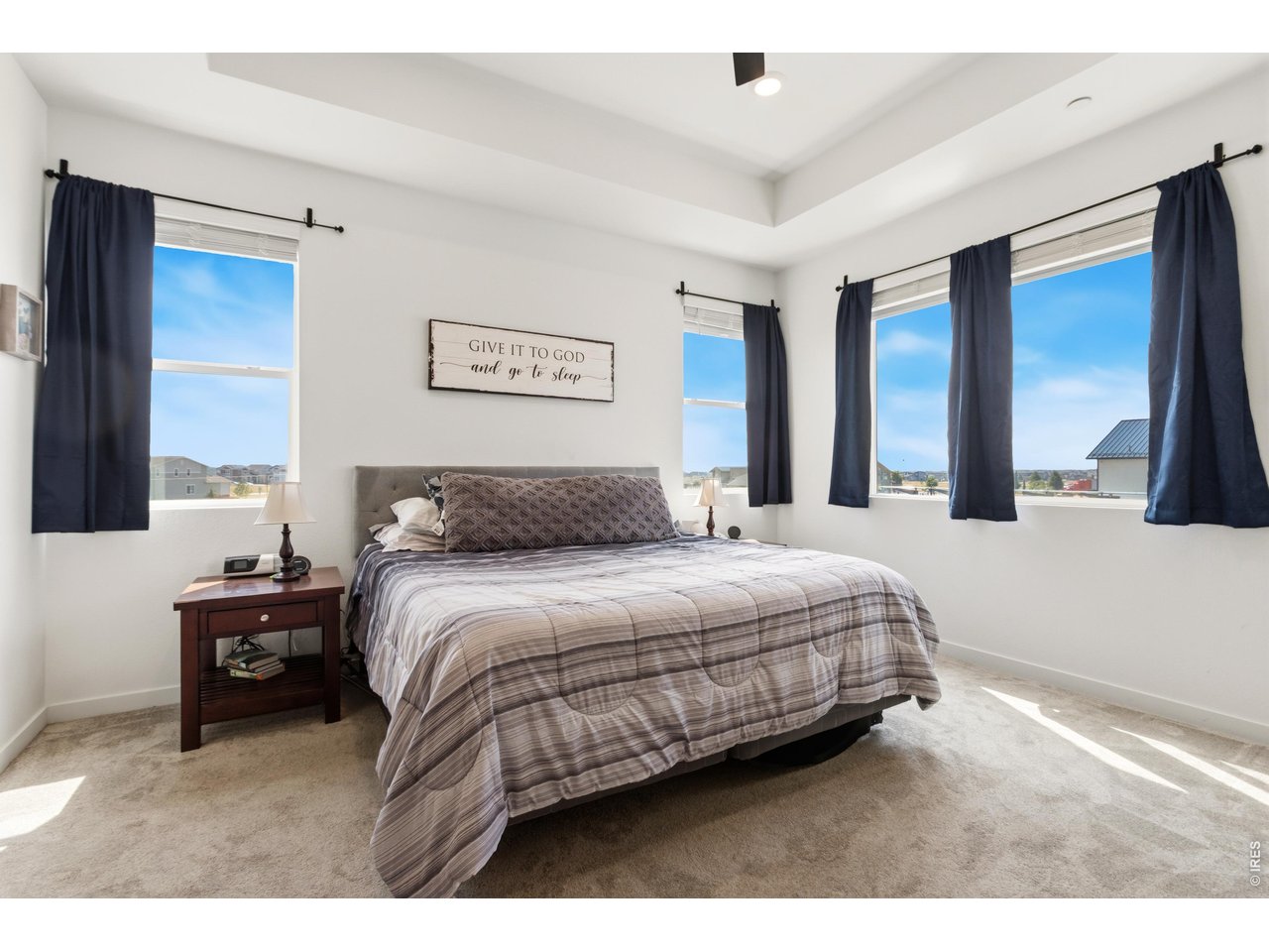 Property Photo 14 Spacious primary suite surrounded by windows and natural light.