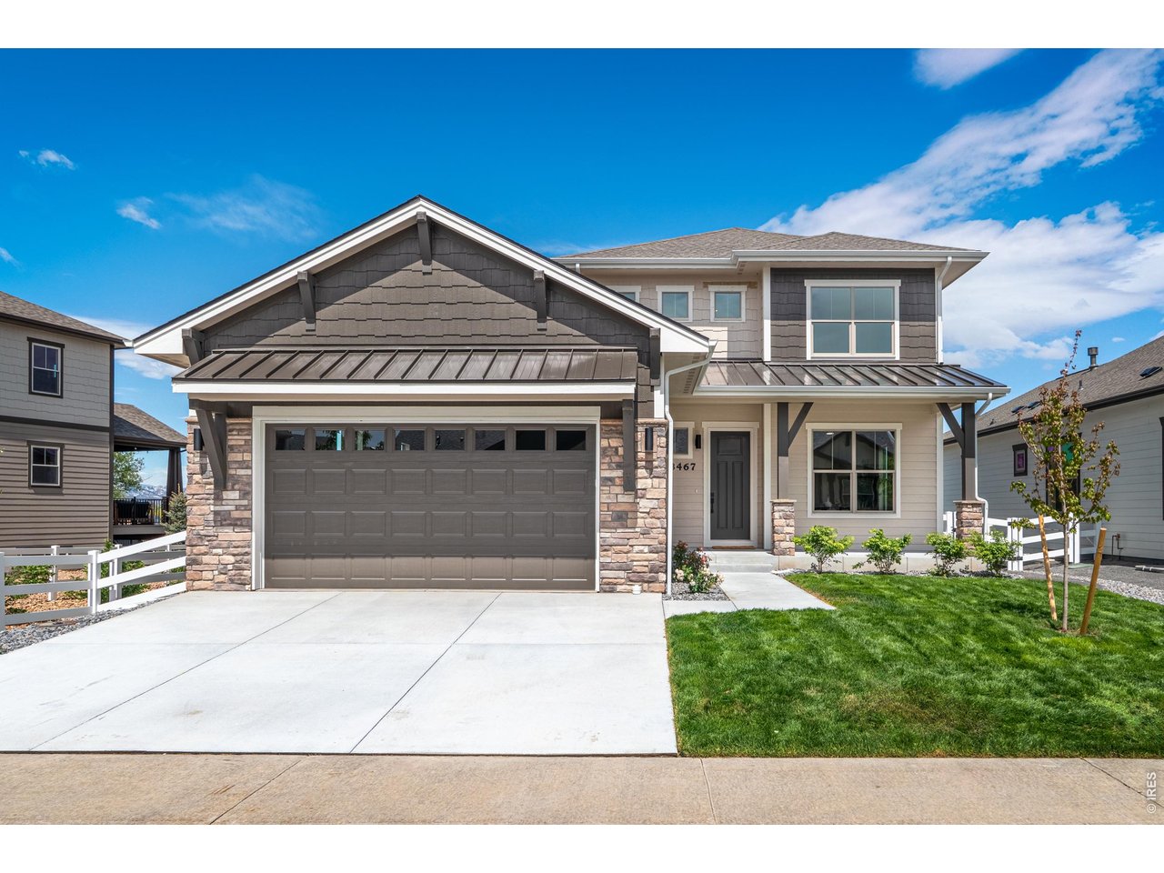Property Photo 2 3-car tandem insulated garage and fully landscaped front and backyard.