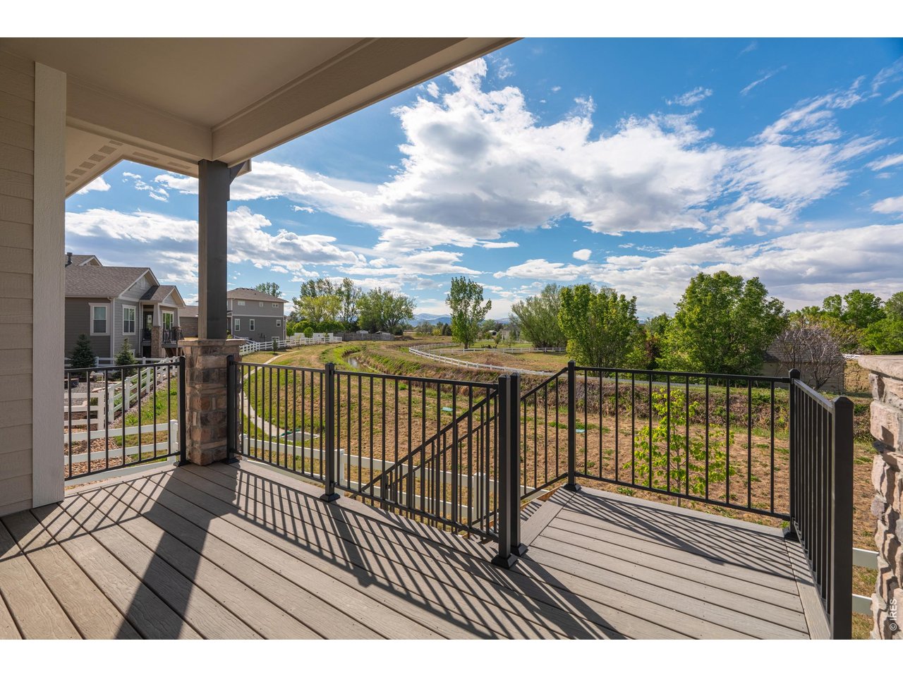 Property Photo 42 Elevated outdoor living with railing enclosure and scenic natural backdrop