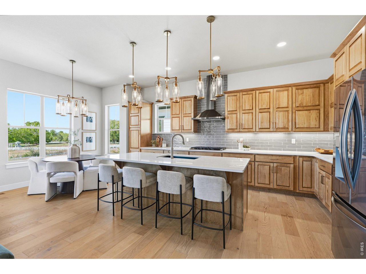Property Photo 3 Gourmet kitchen featuring quartz countertops, stainless steel appliances, and abundant cabinetry.