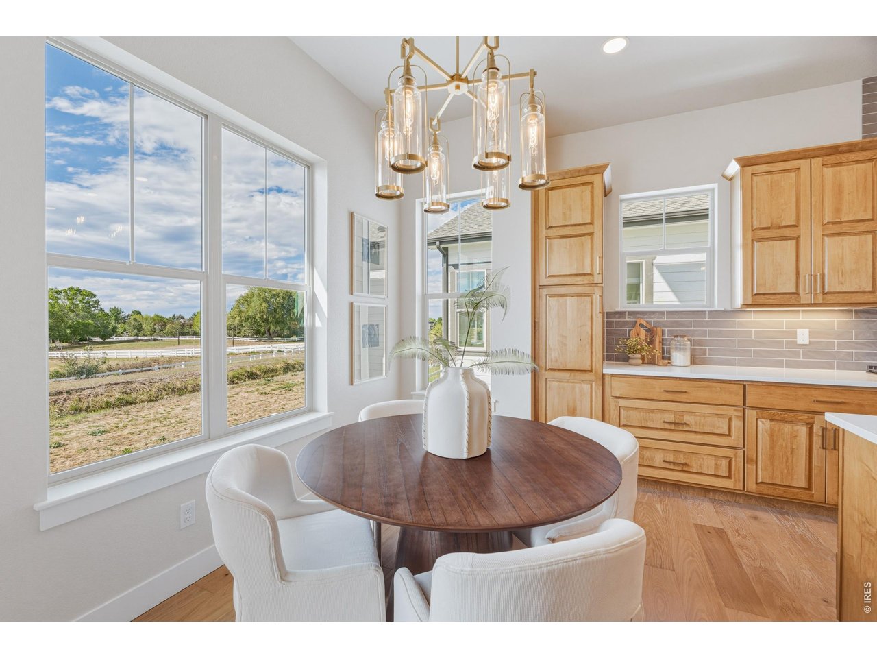 Property Photo 4 Dedicated dining space with natural light and elevated finishes.