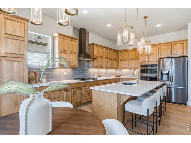 Property Photo 7 Oversized island with seating, perfect for entertaining and everyday living.