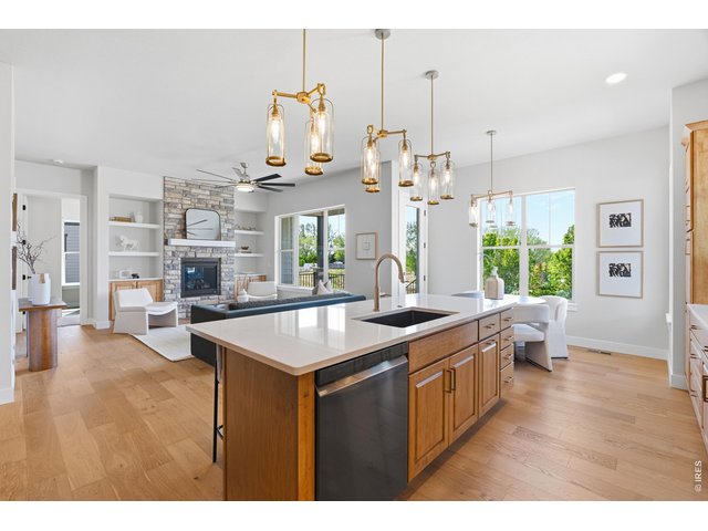 Property Photo 10 Open-concept living at its best-this spacious kitchen flows seamlessly into the living room.