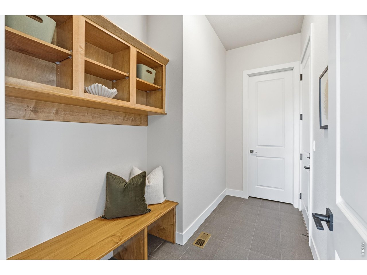 Property Photo 15 Mudroom with built-in bench and storage-perfect for keeping everyday life organized.