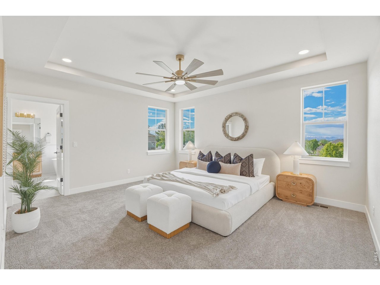 Property Photo 20 Expansive primary suite with tray ceilings, oversized windows, and plenty of room to unwind.