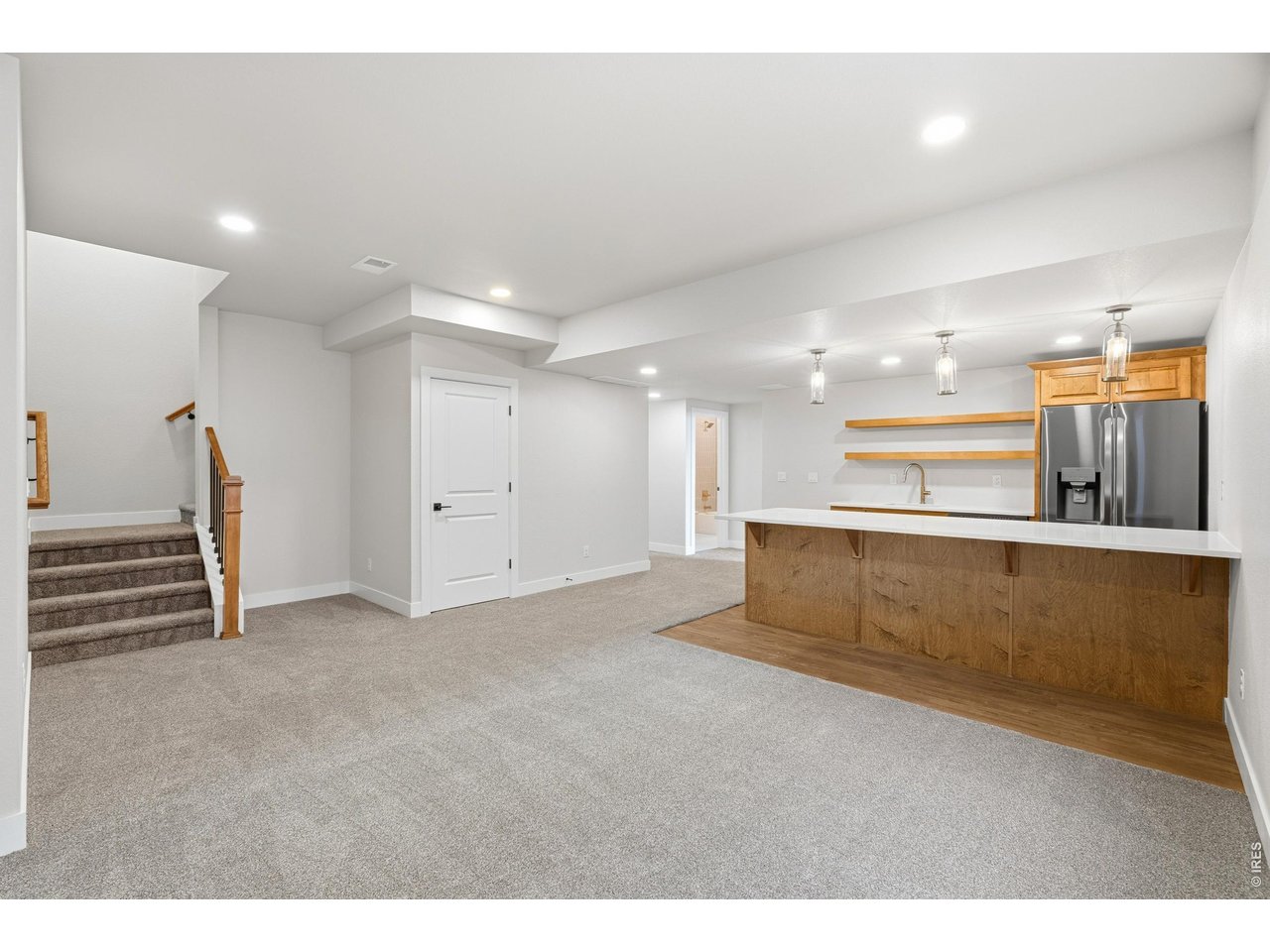 Property Photo 34 Expansive finished basement offering endless flexibility-perfect for movie nights, play space, or hosting friends and family.