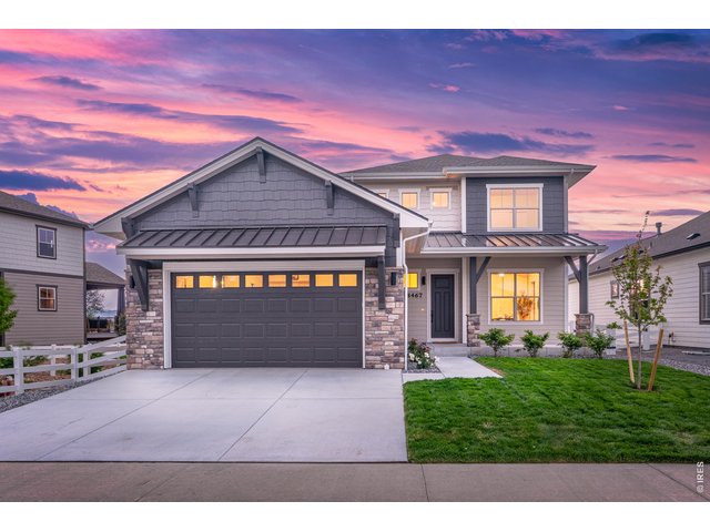 Property Photo 47 Striking curb appeal with stone accents, covered front porch, and a tandem 3-car garage