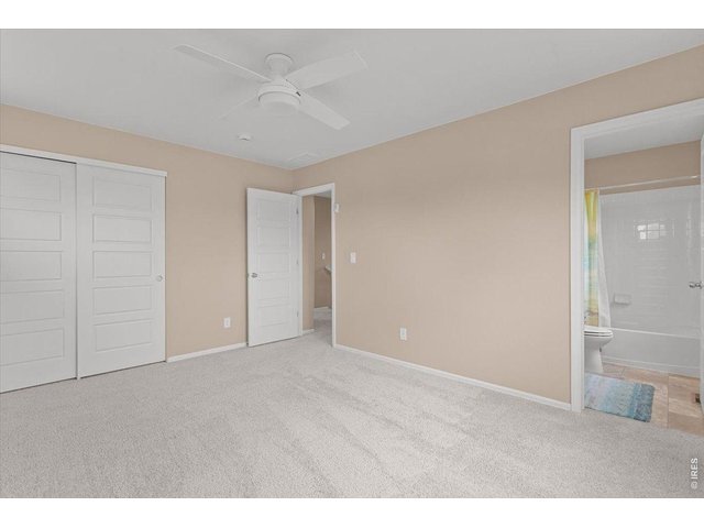 Property Photo 29 Upstairs bedroom w/ en suite bath