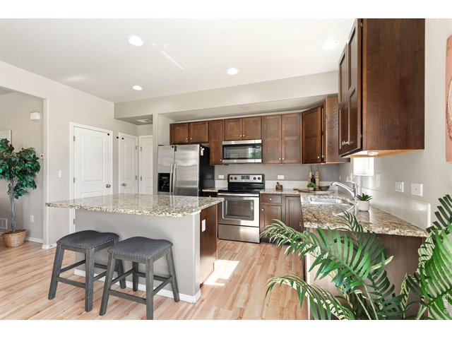 Property Photo 10 Bright and open layout on the main floor. All kitchen appliances included!