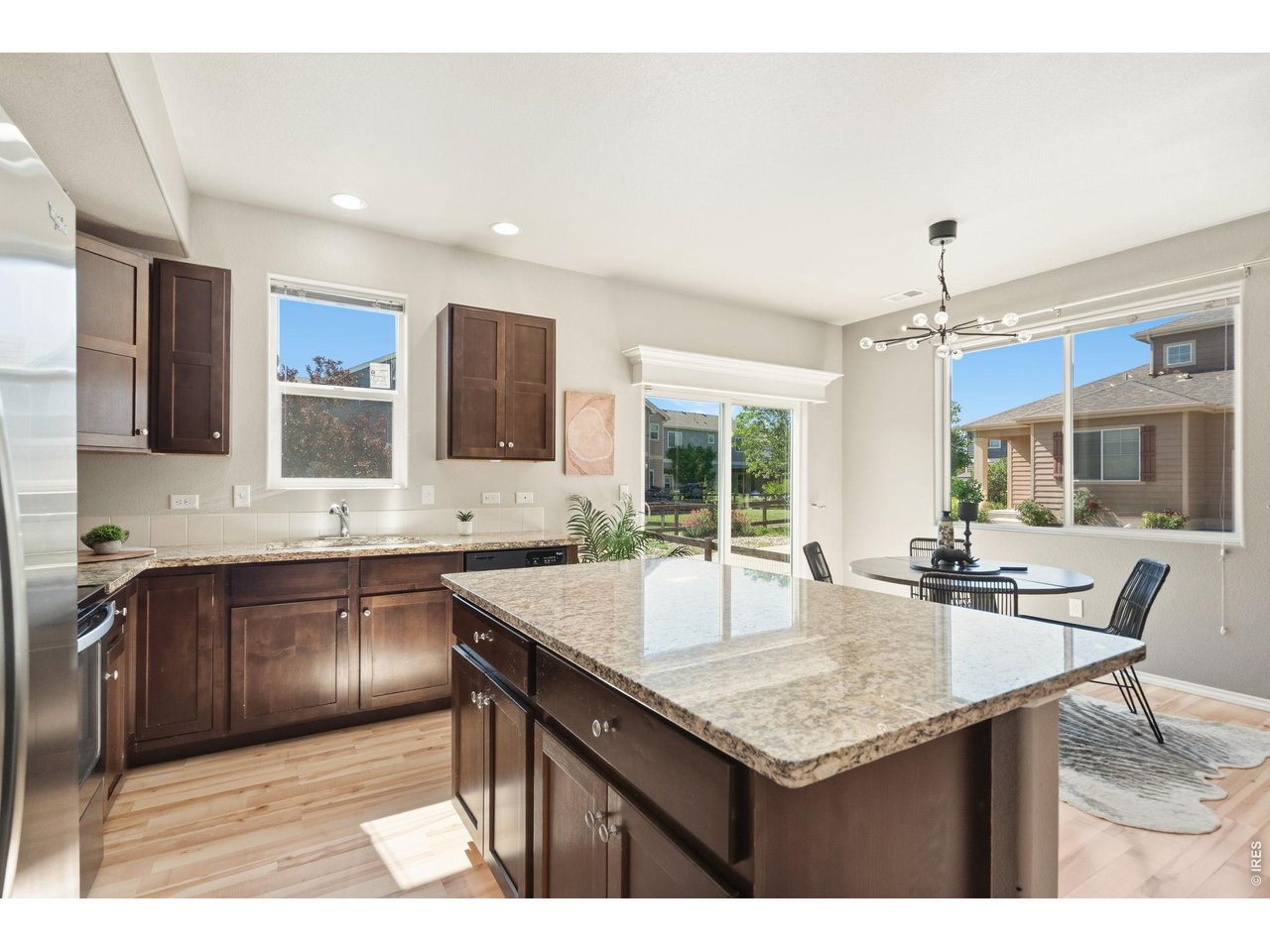 Property Photo 14 Granite countertops, ample cabinets for storage, and a pantry with built-in shelving.