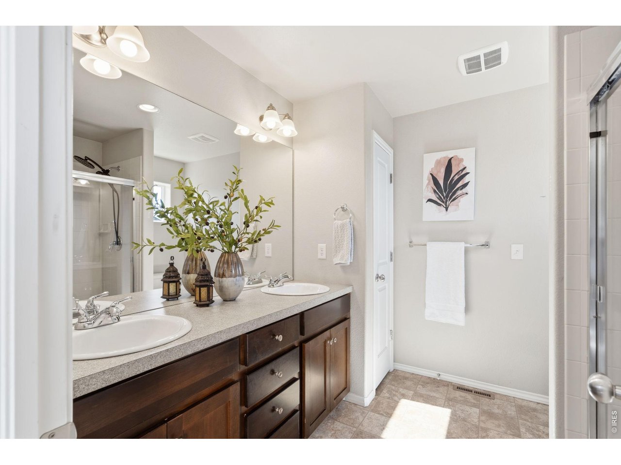 Property Photo 22 The large master bath features a large two-sink vanity and linen closet.