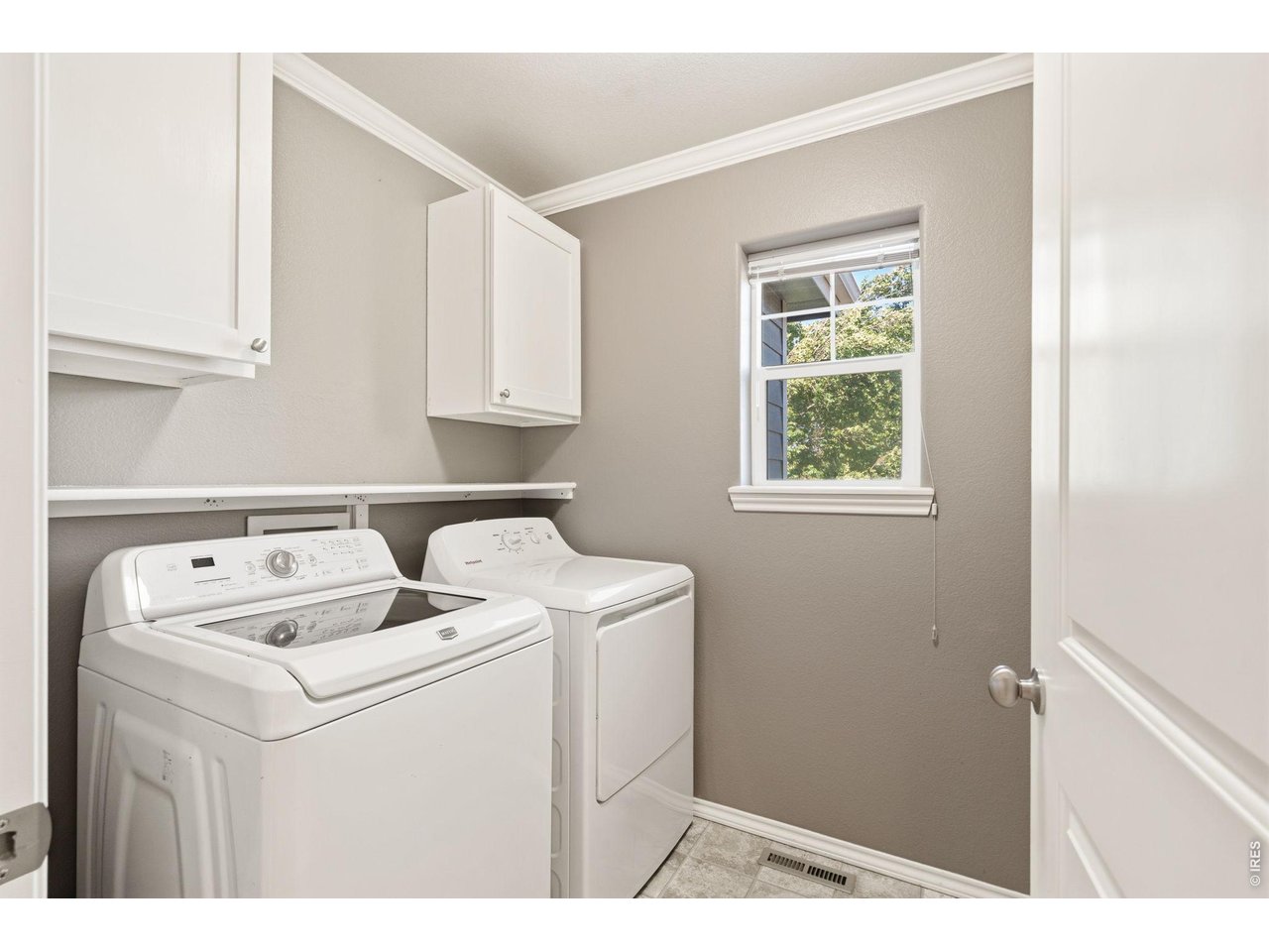 Property Photo 28 Second level laundry room - washer and dryer are included.