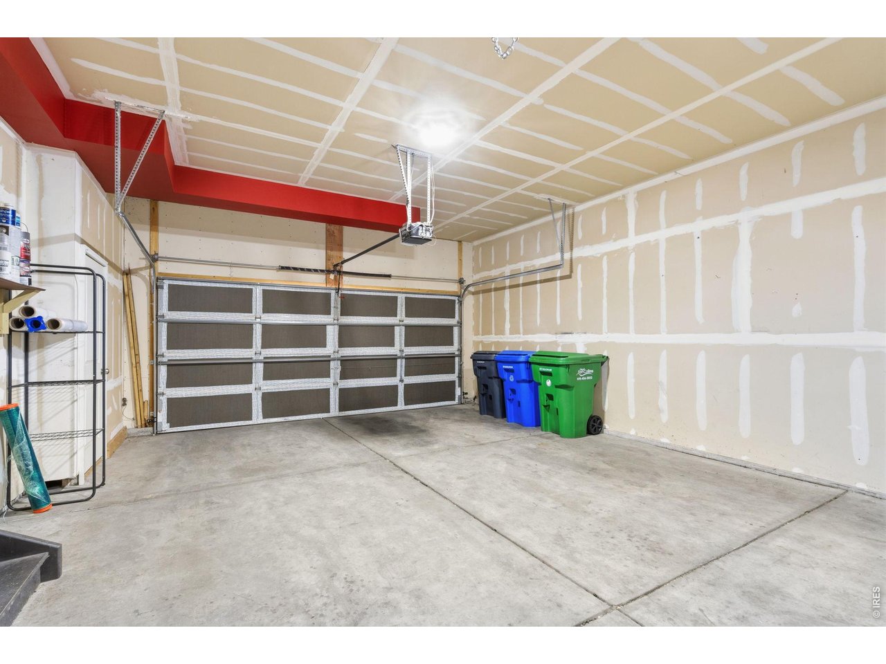 Property Photo 42 Two-car attached garage with automatic doors and extra room for storage.