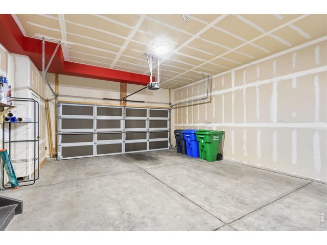 Property Photo 42 Two-car attached garage with automatic doors and extra room for storage.