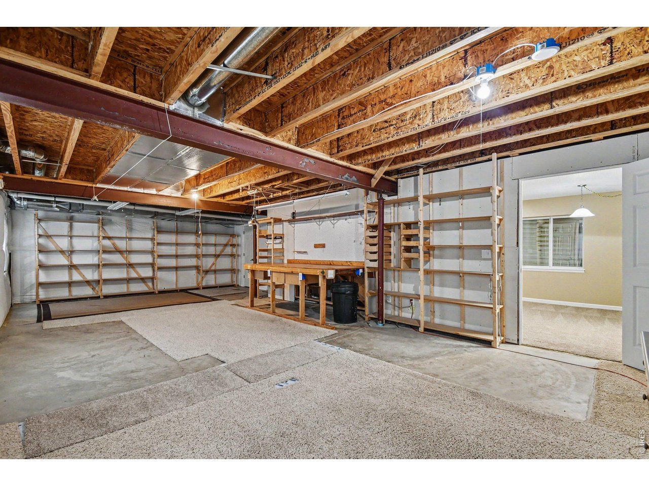 Property Photo 27 Huge Unfinished Basement Workshop, Ready for Hobbies, Exercise or More!