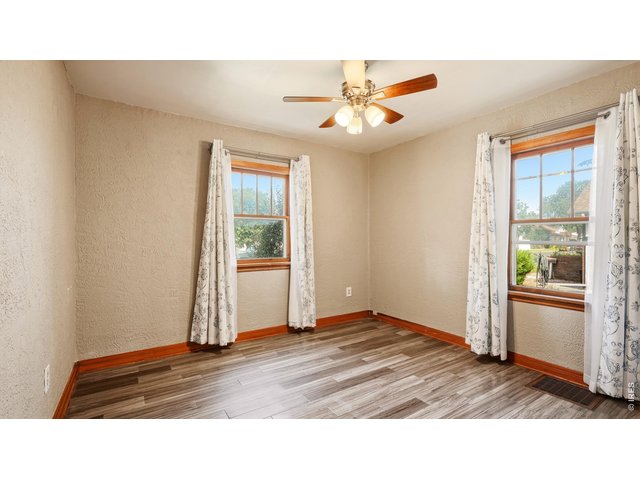 Property Photo 12 Main-level bedroom with windows on two sides.