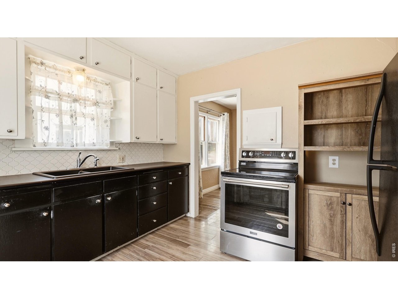 Property Photo 11 Kitchen with additional storage and appliance space.