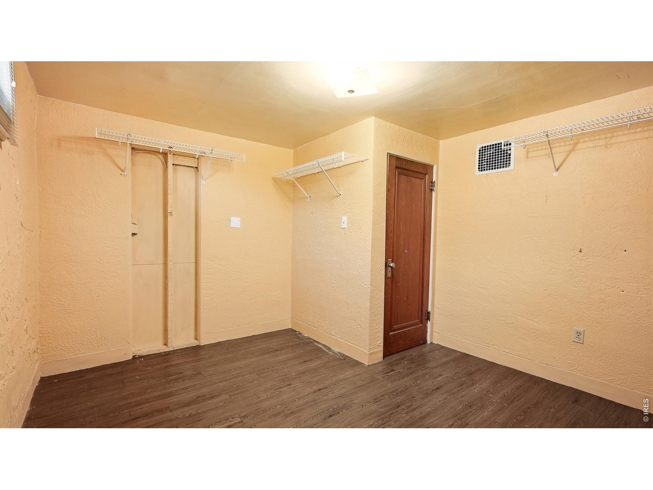 Property Photo 17 Additional finished basement room with storage space.