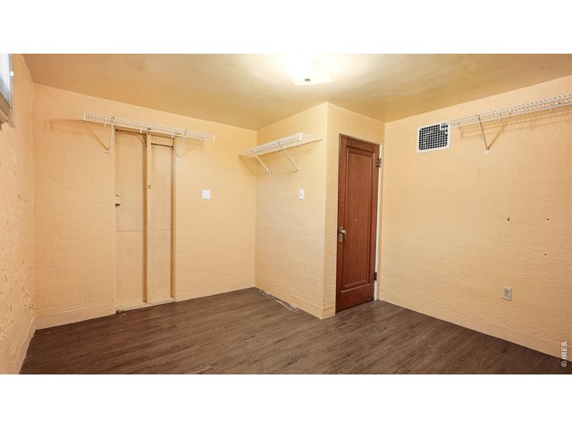Property Photo 17 Additional finished basement room with storage space.