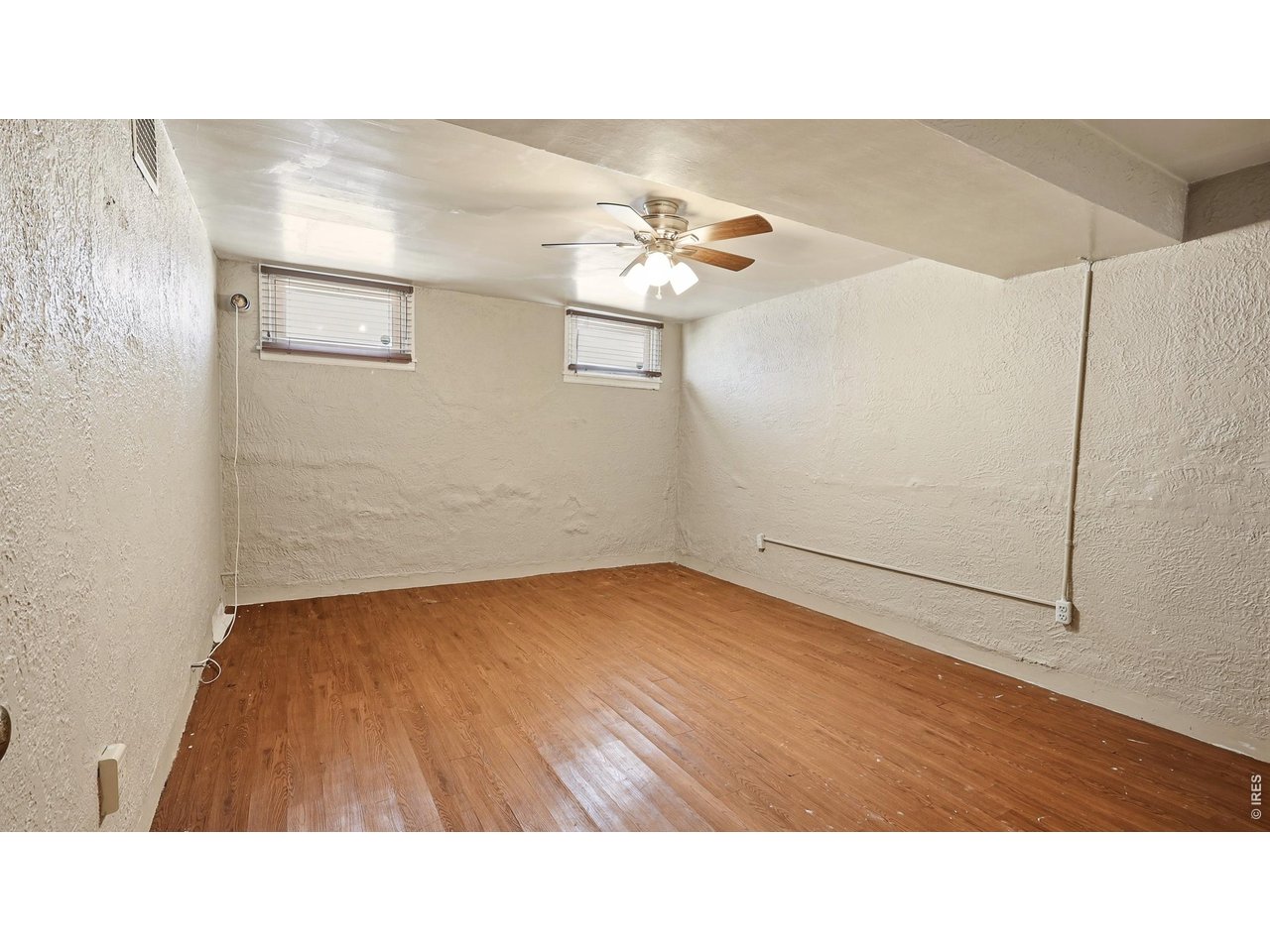 Property Photo 18 Finished basement flex room with LVP flooring.