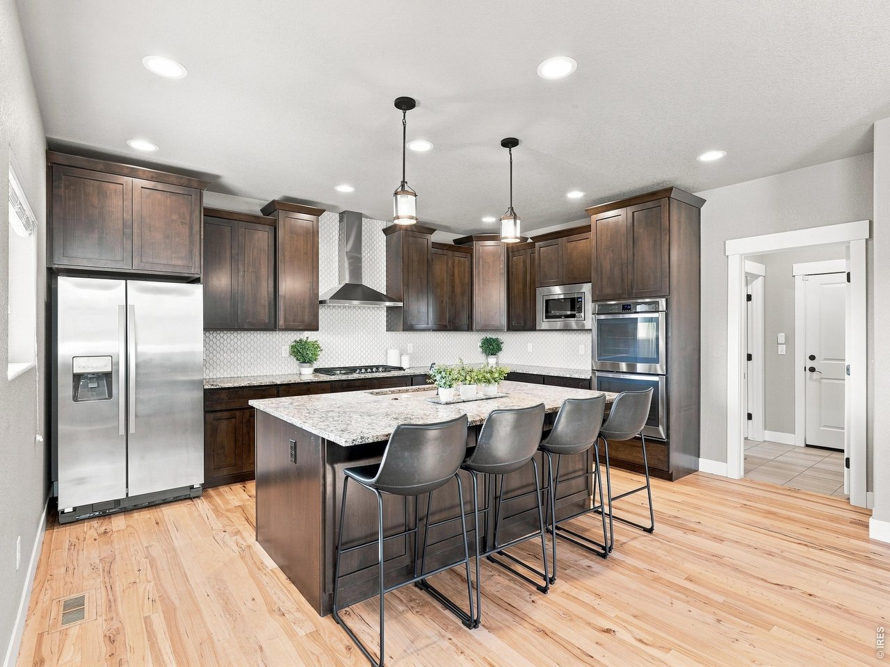 Property Photo 12 Stainless steel appliances including a double oven making entertaining and holiday cooking a breeze.