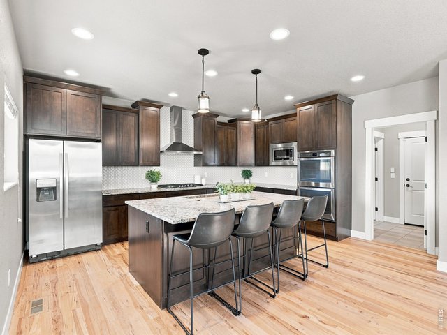 Property Photo 12 Stainless steel appliances including a double oven making entertaining and holiday cooking a breeze.