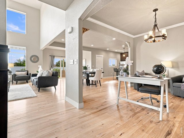 Property Photo 6 A stunning open floor plan connects the living room, kitchen, and dining spaces.