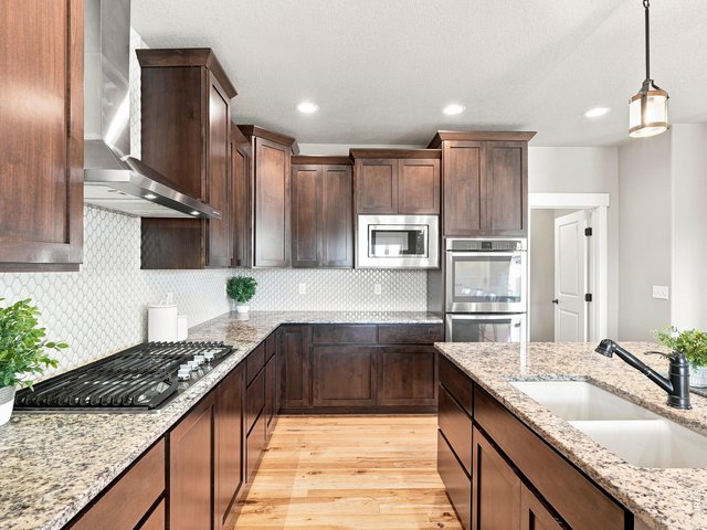 Property Photo 4 Spacious gourmet kitchen designed with both function and style in mind.