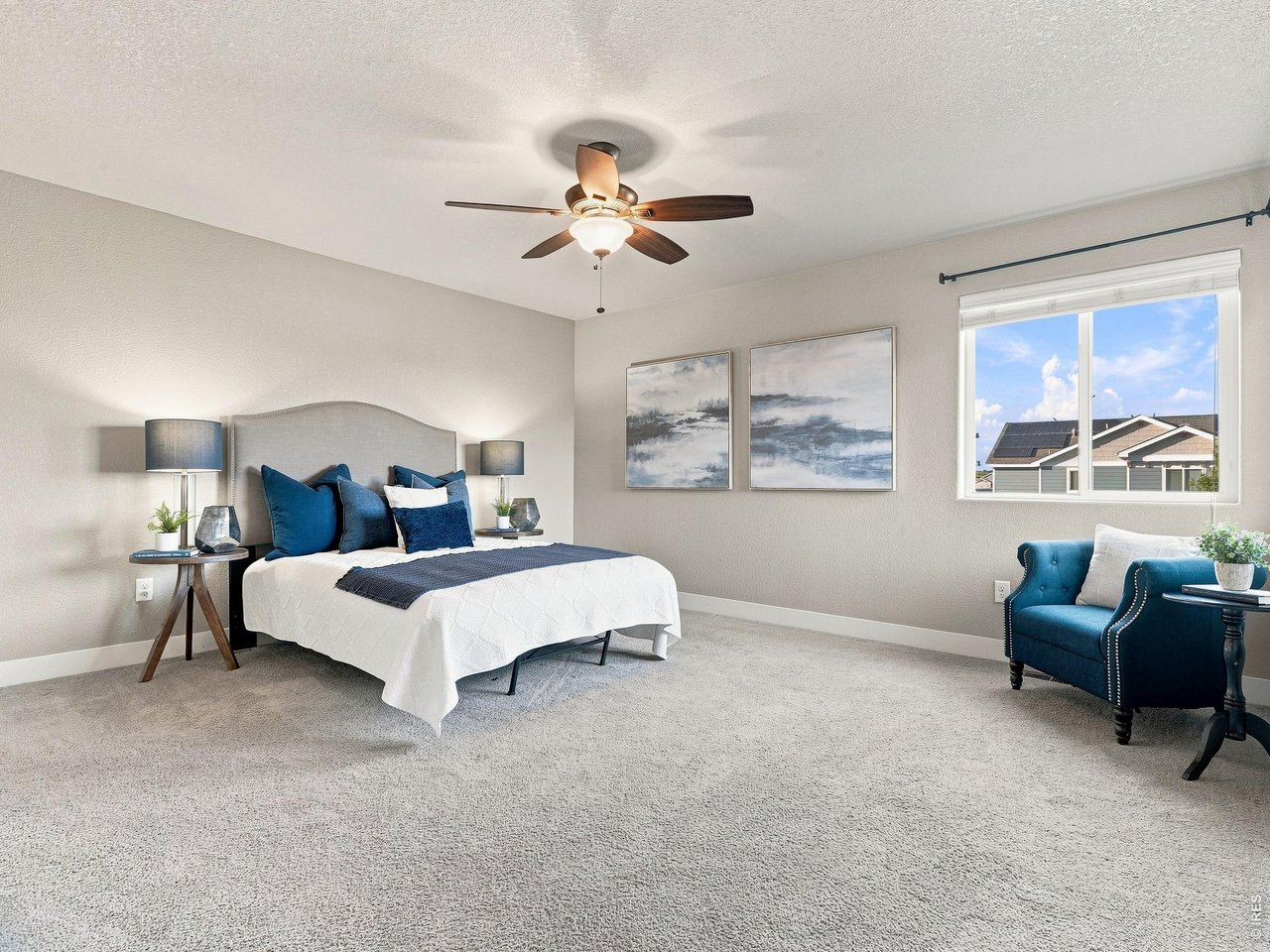 Property Photo 22 The generous primary suite offers plenty of room for king-sized furnishings.