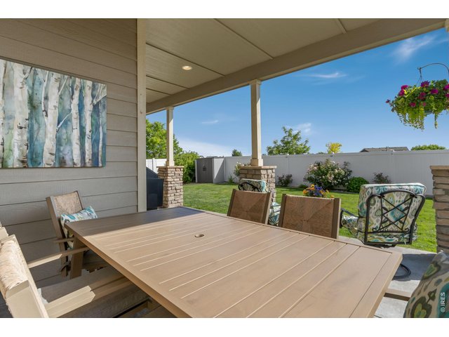 Property Photo 46 The extended covered patio creates the perfect setting for outdoor dining, entertaining, and enjoying Colorado's beautiful seasons.