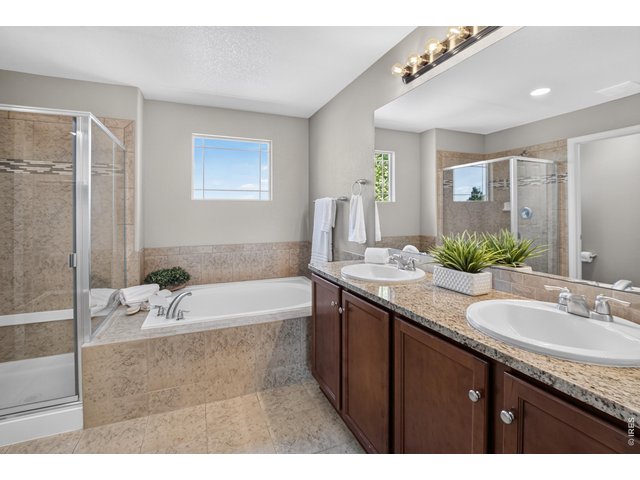 Property Photo 26 Primary bathroom with dual sinks, soaking tub and walk-in shower