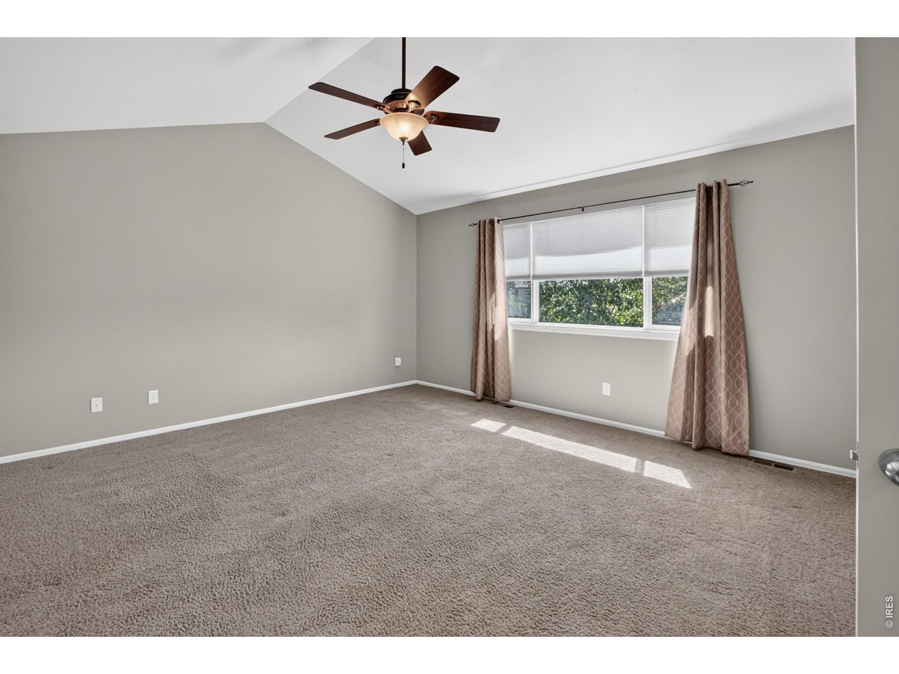 Property Photo 24 Generously sized primary bedroom with high ceilings