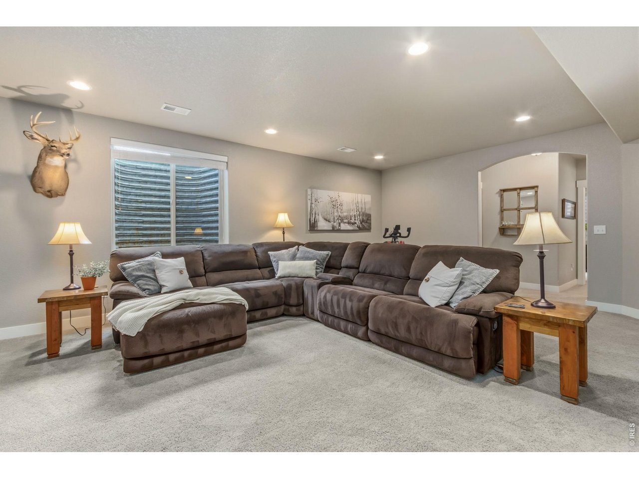 Property Photo 33 Spacious family room offers endless possibilities for recreation or movie nights.