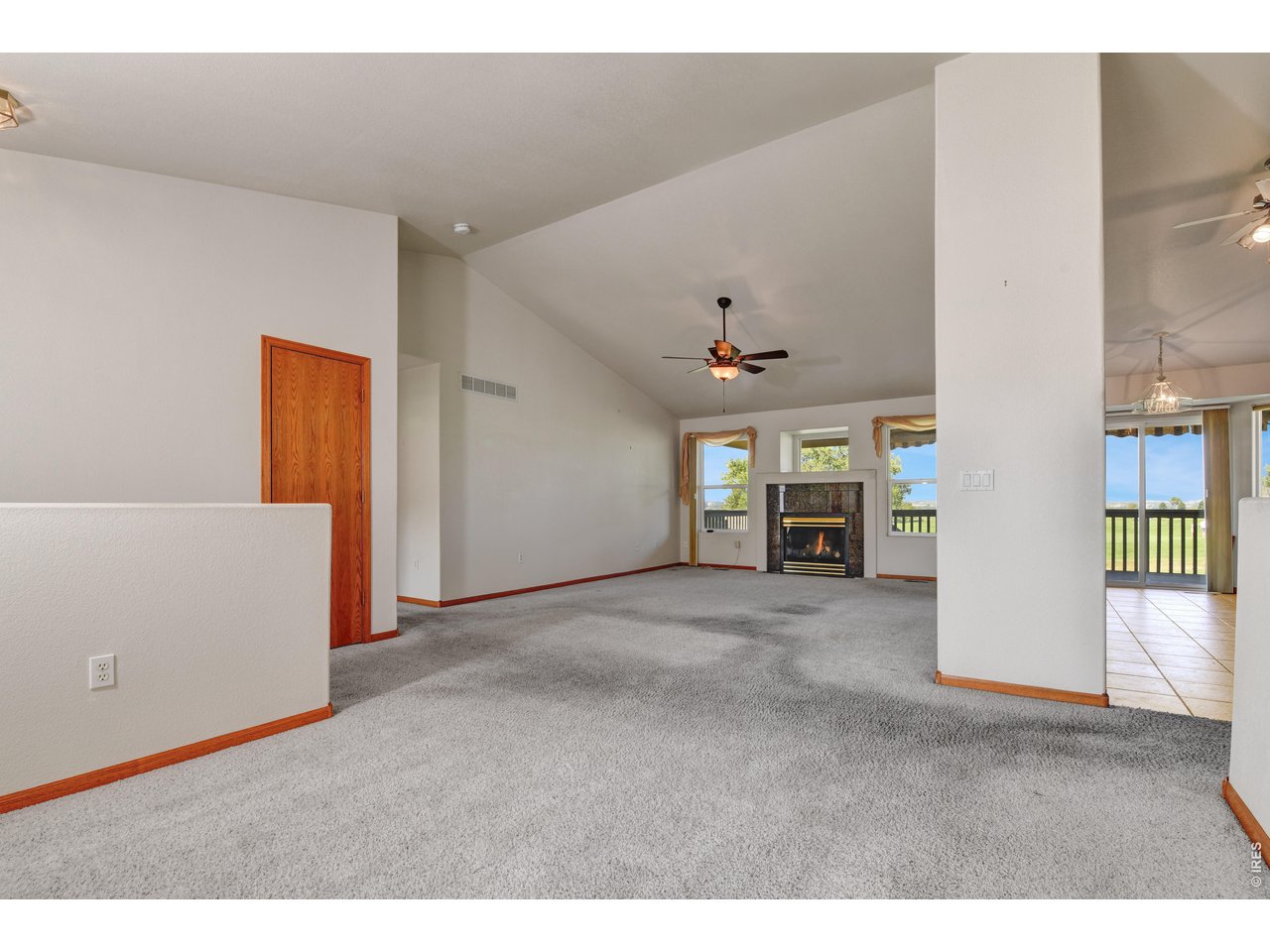 Property Photo 4 Living room - Kitchen dining area to the right Hall to bedrooms to the left
