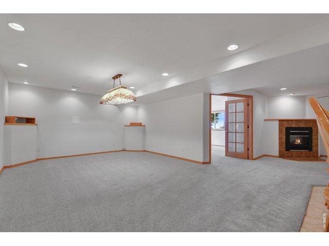 Property Photo 19 Basement Family room with Fireplace