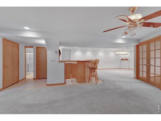 Property Photo 20 Bar with granite counter top Sink and refrigerator
