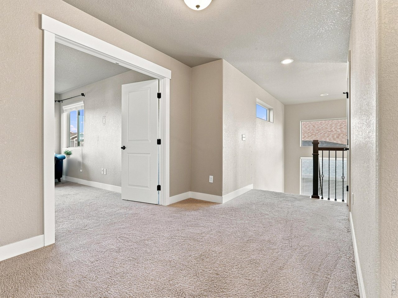 Property Photo 23 Open upper-level landing with additional storage and linen closet.