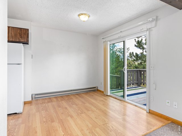 Property Photo 5 Unit 1: Dining room opens to private deck