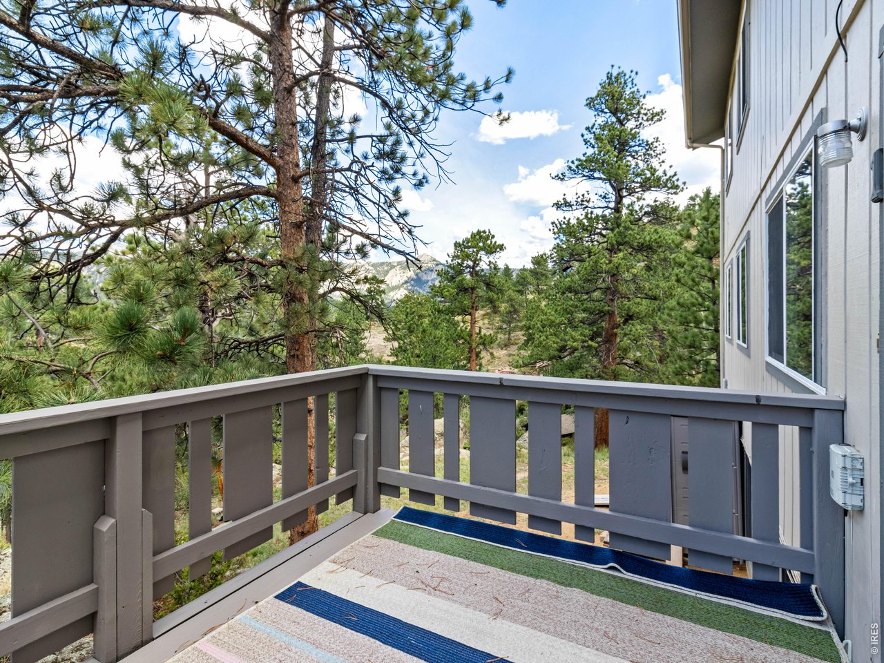 Property Photo 6 Unit 1: Private deck in the pines with views